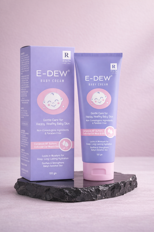 E-Dew baby cream packaging and tube on a gray background