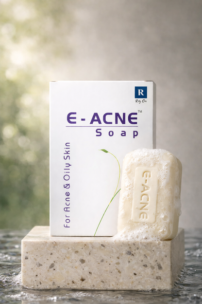 E-Acne soap bar and packaging on a stone surface with a blurred natural background
